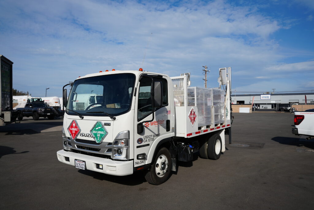 Specialty gas delivery truck at an industrial facility.