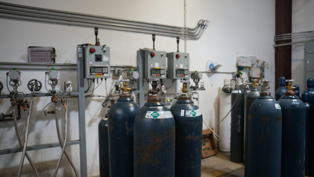 WestAir carbon dioxide cylinders connected to a manifold gas supply system