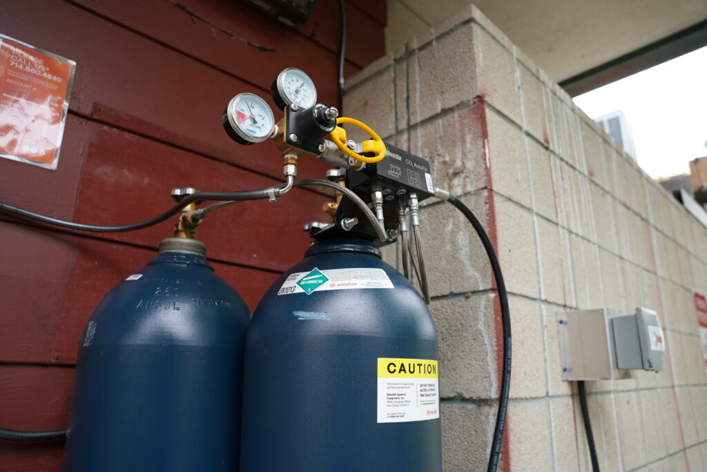 Two WestAir carbon dioxide cylinders connected to a CO₂ AutoFill manifold with dual pressure gauges